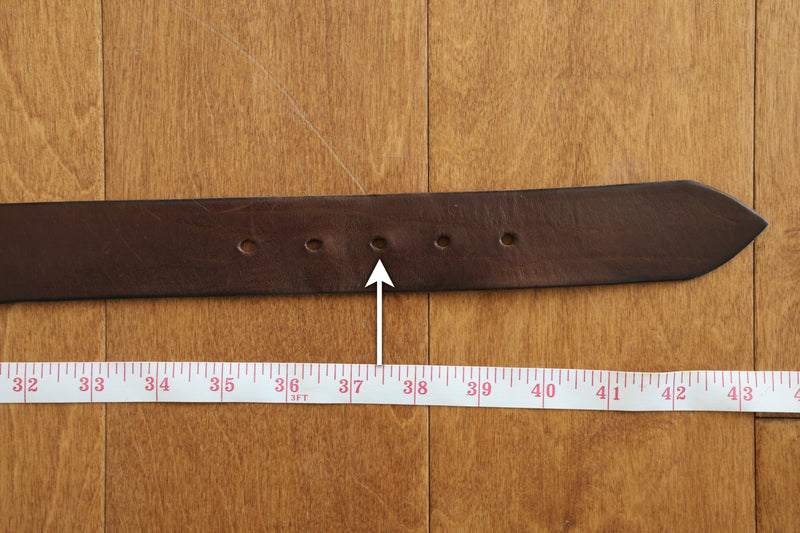 Measure to the hole you use most often.